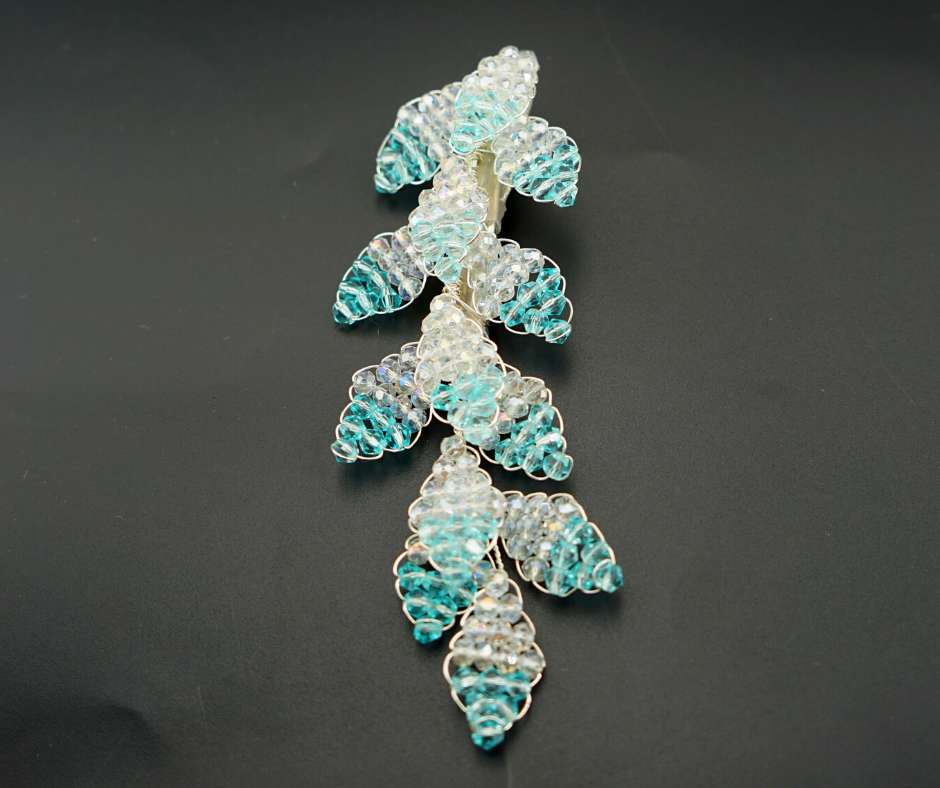 Blue and white diamond-shaped brooch