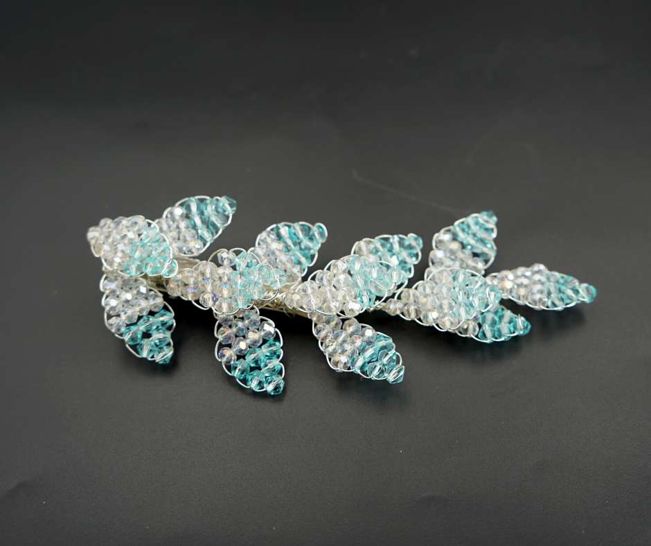 Blue and white diamond-shaped brooch