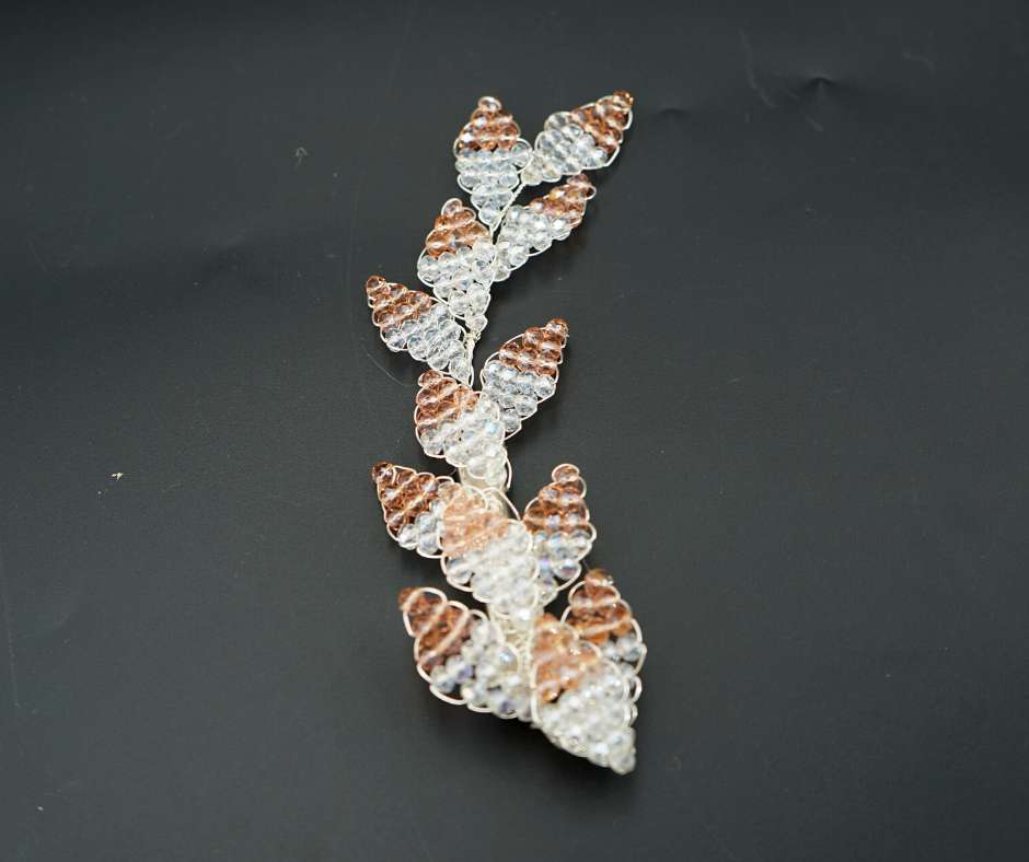 Pink and white diamond-shaped brooch