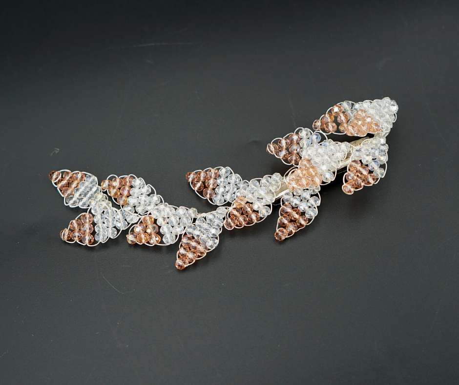 Pink and white diamond-shaped brooch