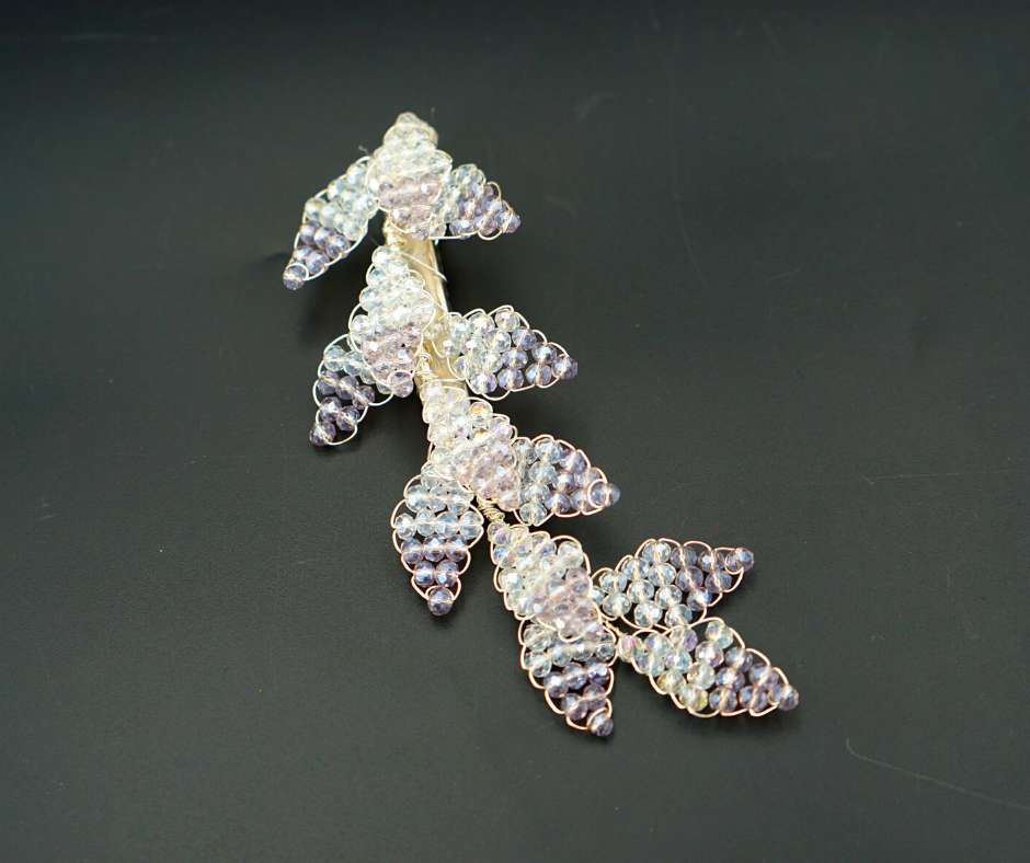 Purple and white diamond-shaped brooch