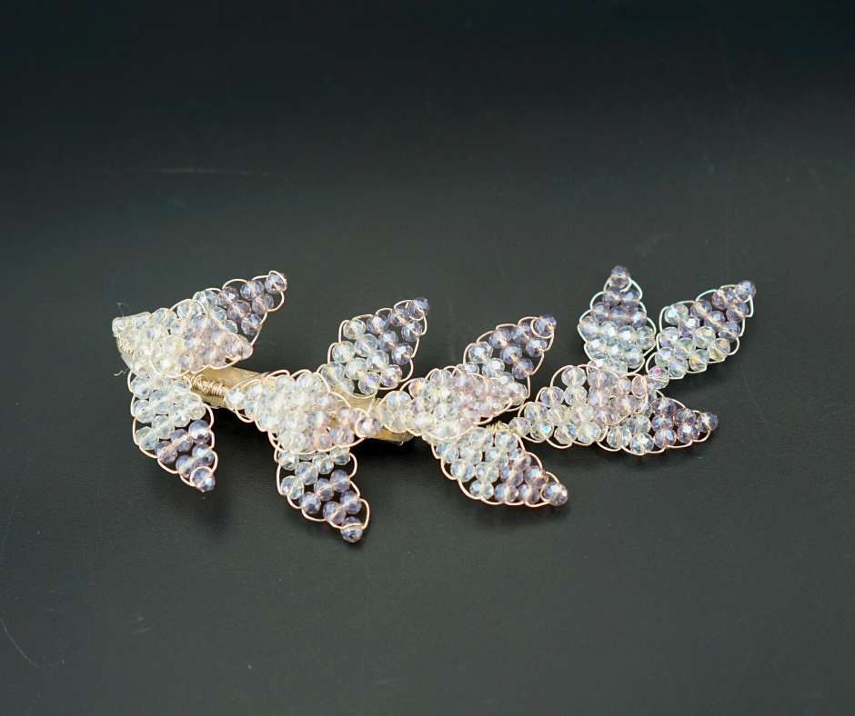 Purple and white diamond-shaped brooch