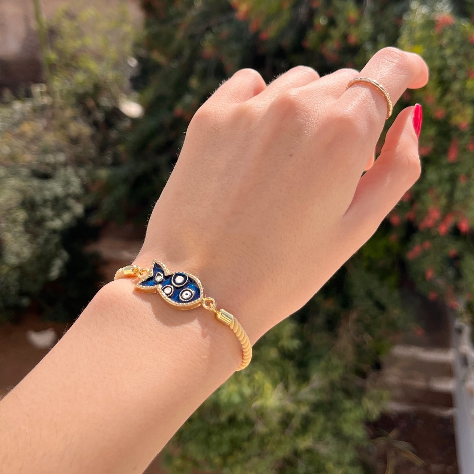 Bracelet poisson doré et bleu avec œil protecteur