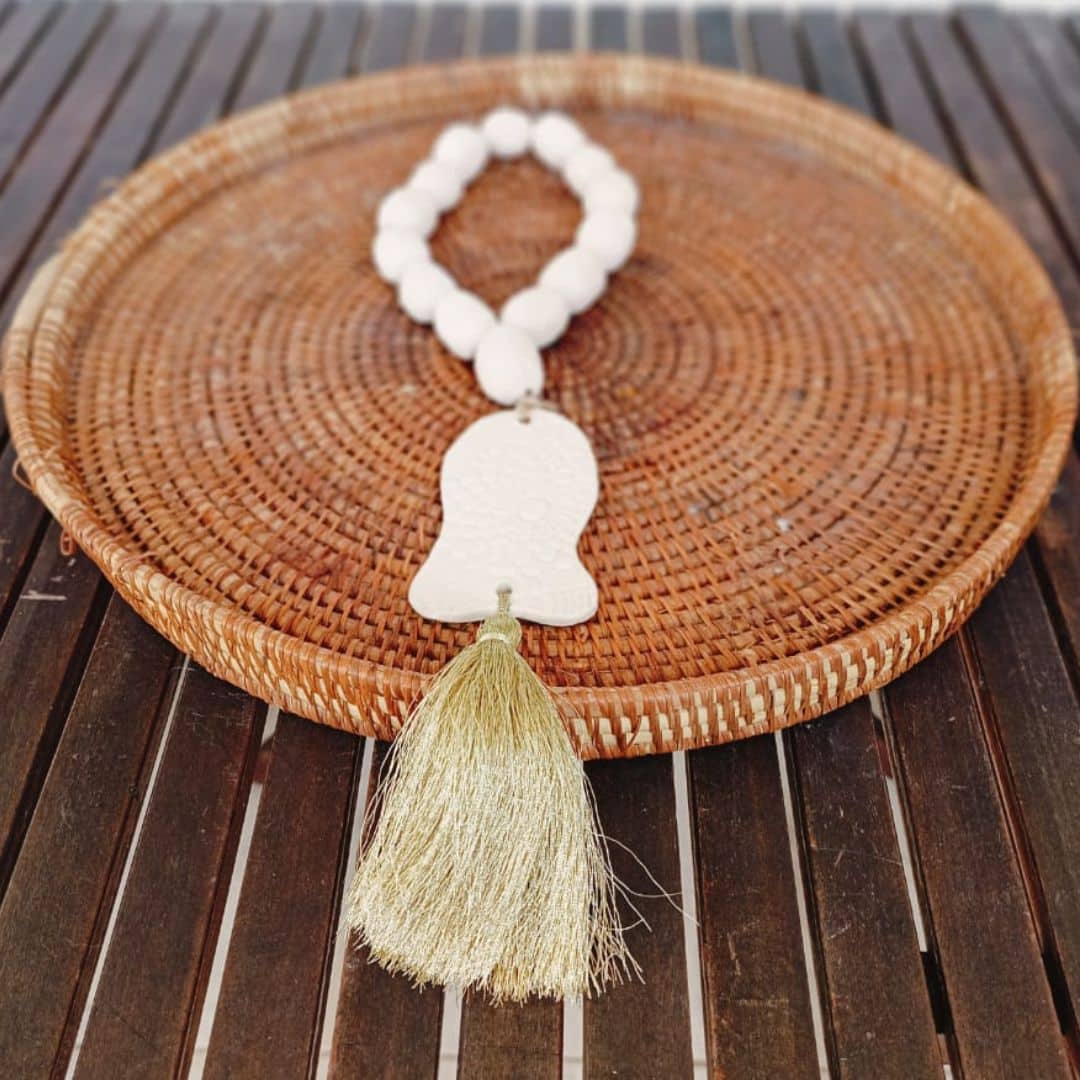 Fish rosary with golden pompom
