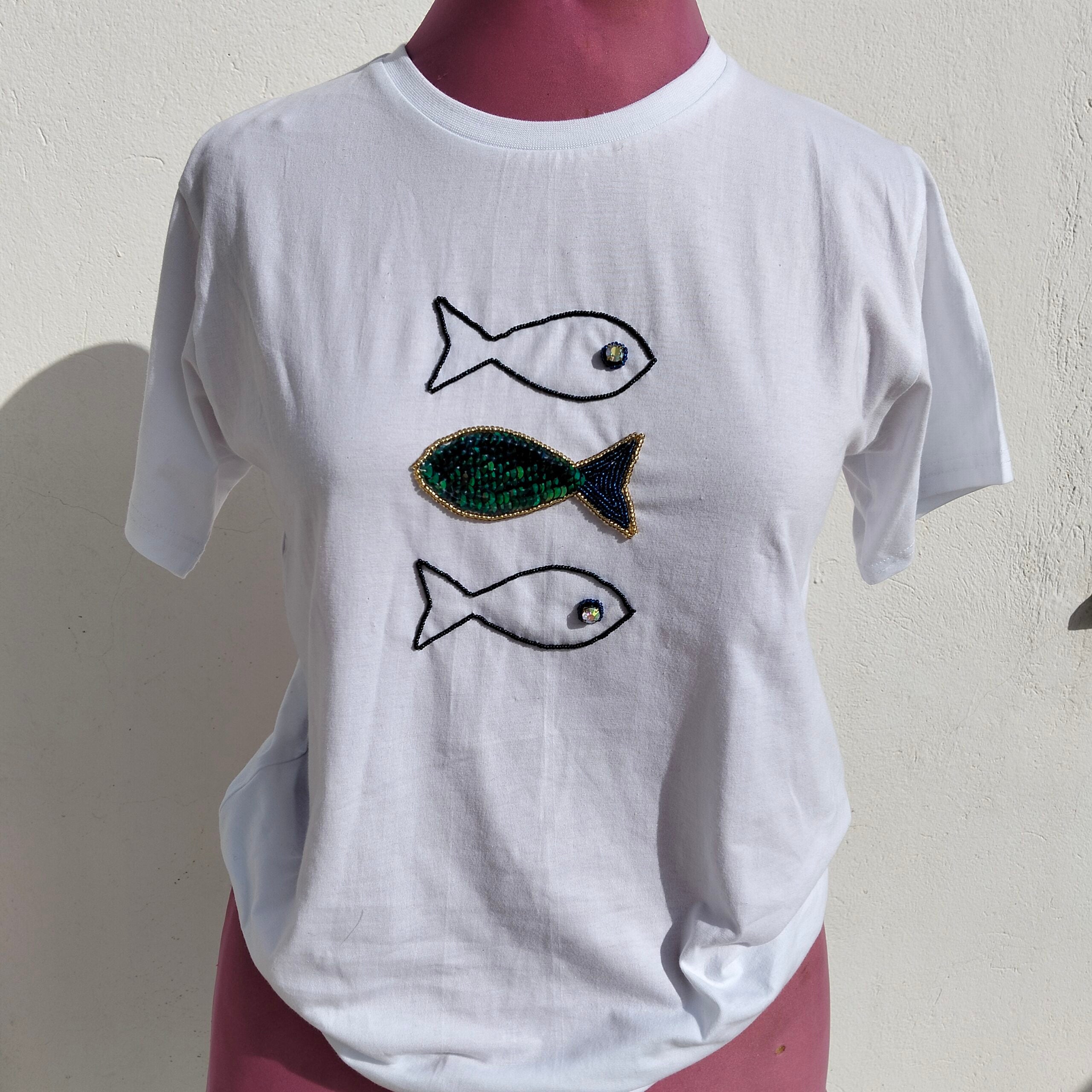 White cotton T-shirt with embroidered blue and green fish pattern