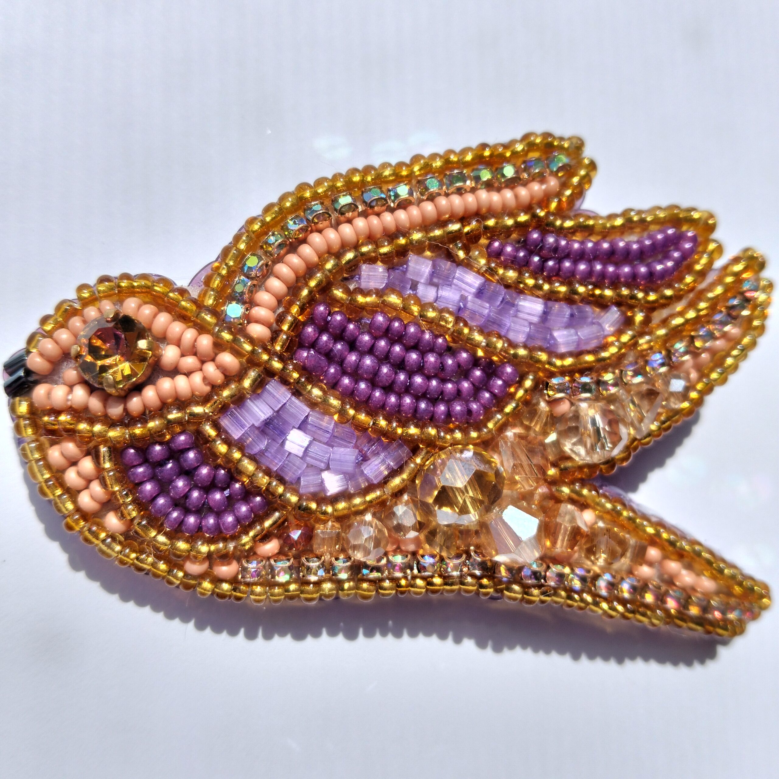 Hand-embroidered bird brooch with Preciosa crystals, bronze & purple