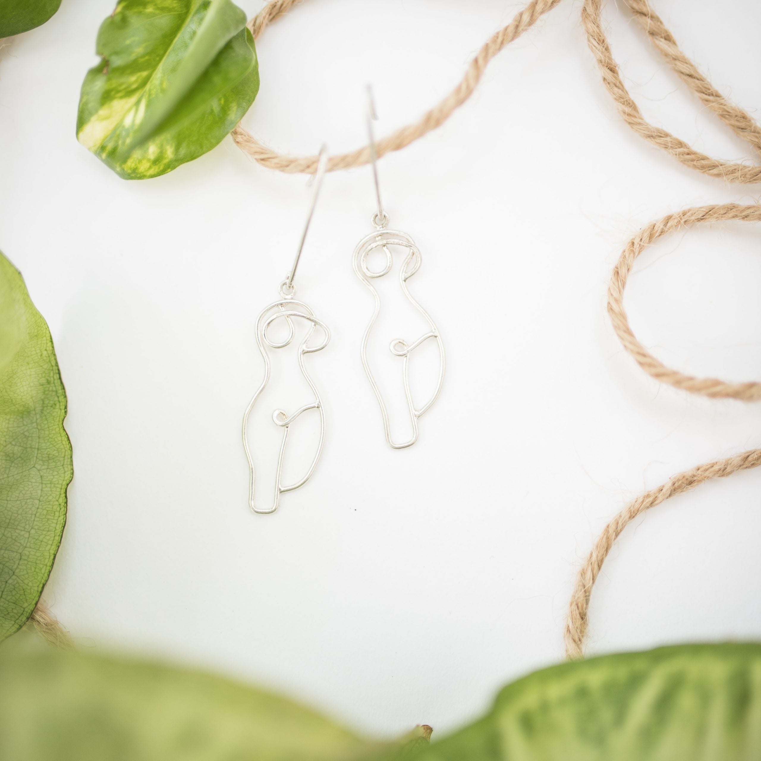 handmade female body earrings in 900 silver