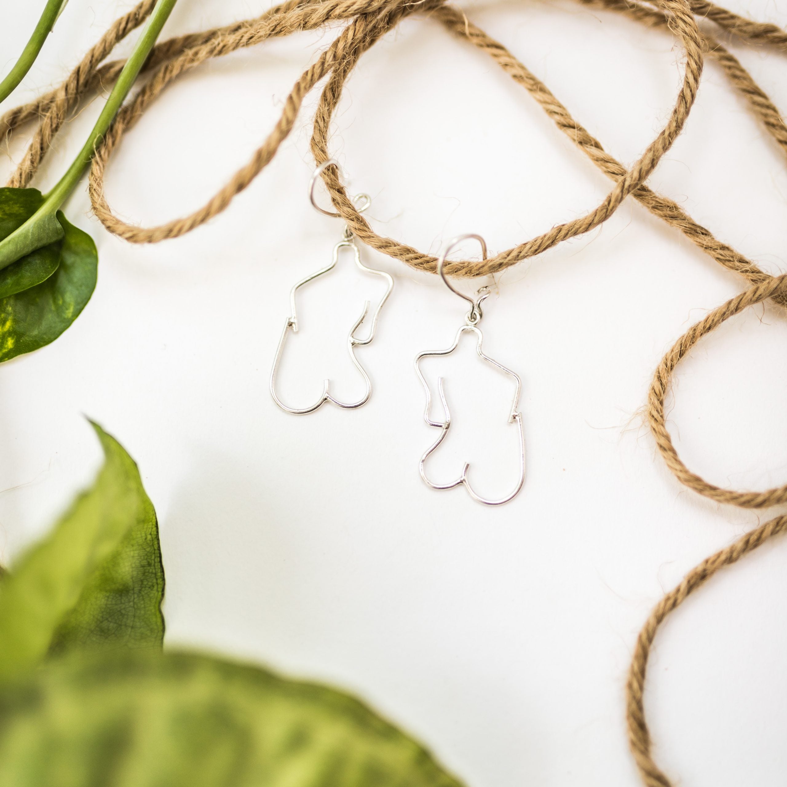 Handmade female body earrings in 900 silver