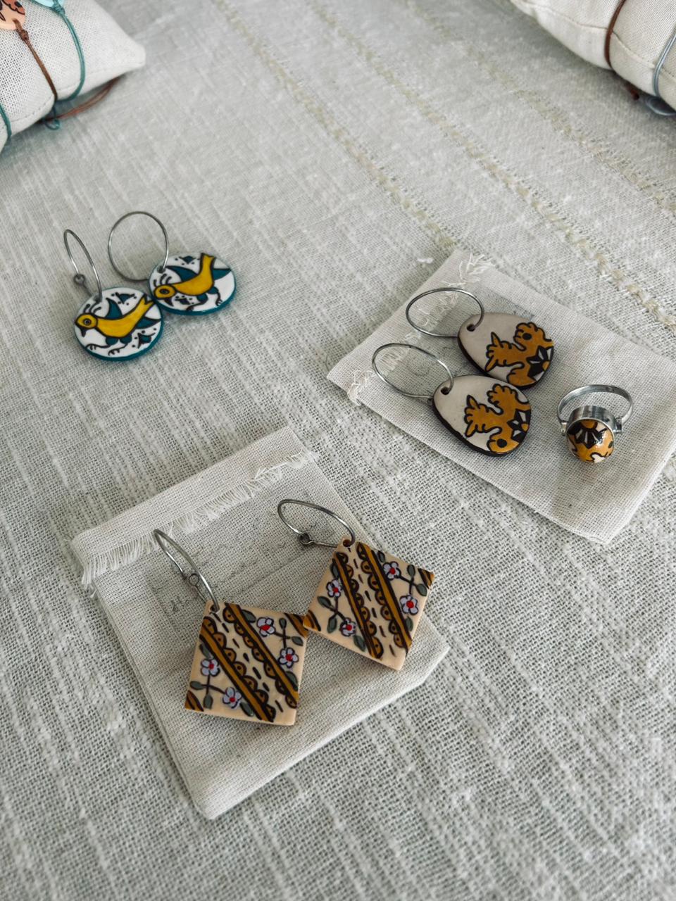 Earring inspired by a traditional handmade ceramic motif, FIMO polymer clay bead and silver post