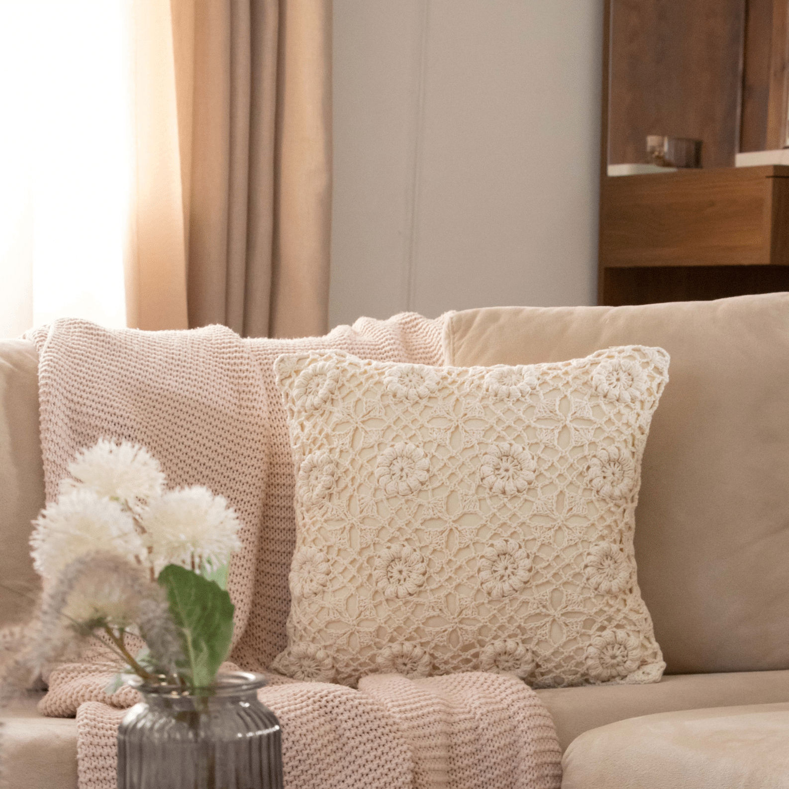 Crochet cushion with floral pattern cushion