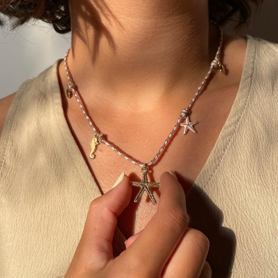 collier étoile de mer dorée chic sur cordon tressé artisanale