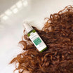 Lotion anti-chute de cheveux à base d'huile essentielle de romarin, huile végétale d'argan et noix de coco