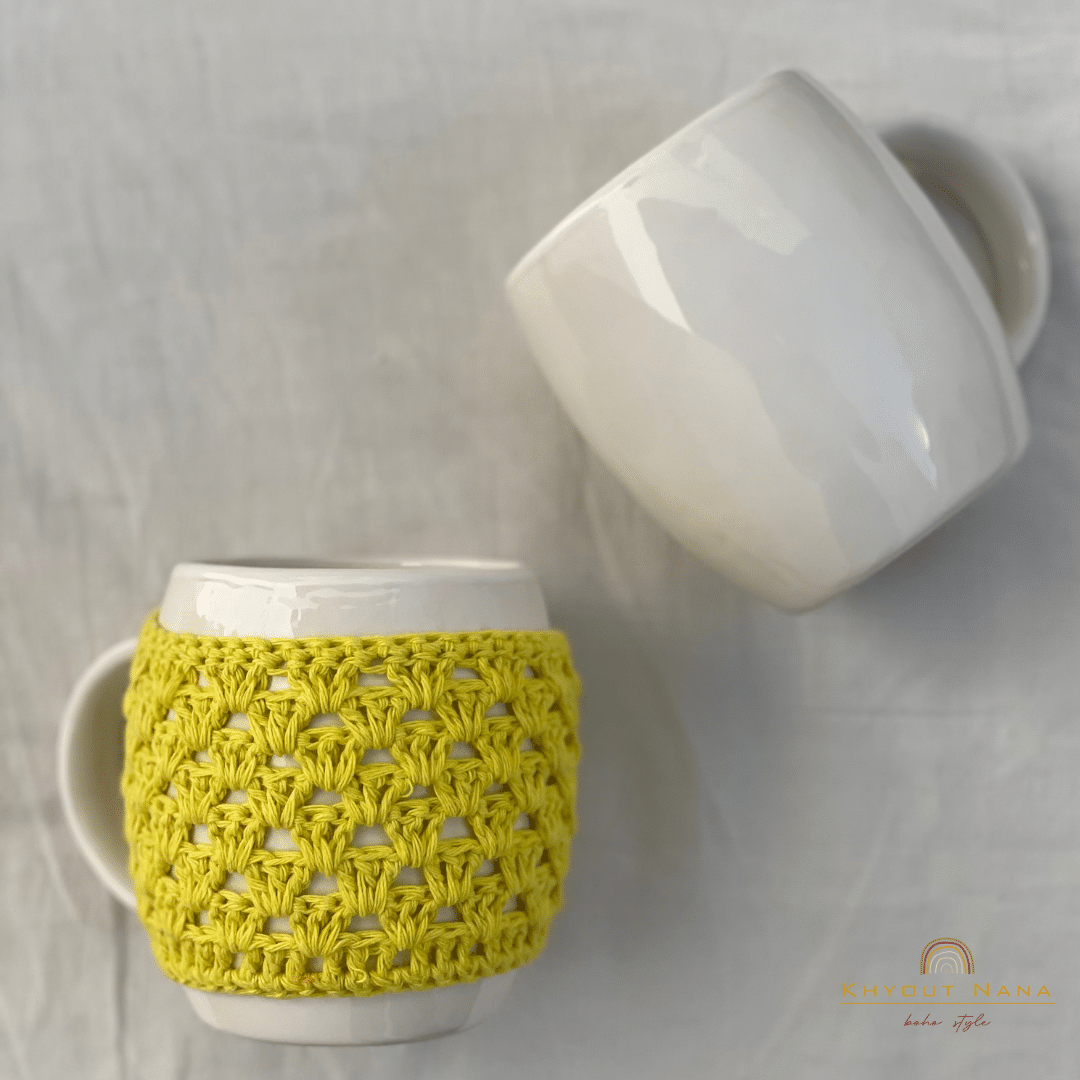 Mug with multi-colored crochet mug cover