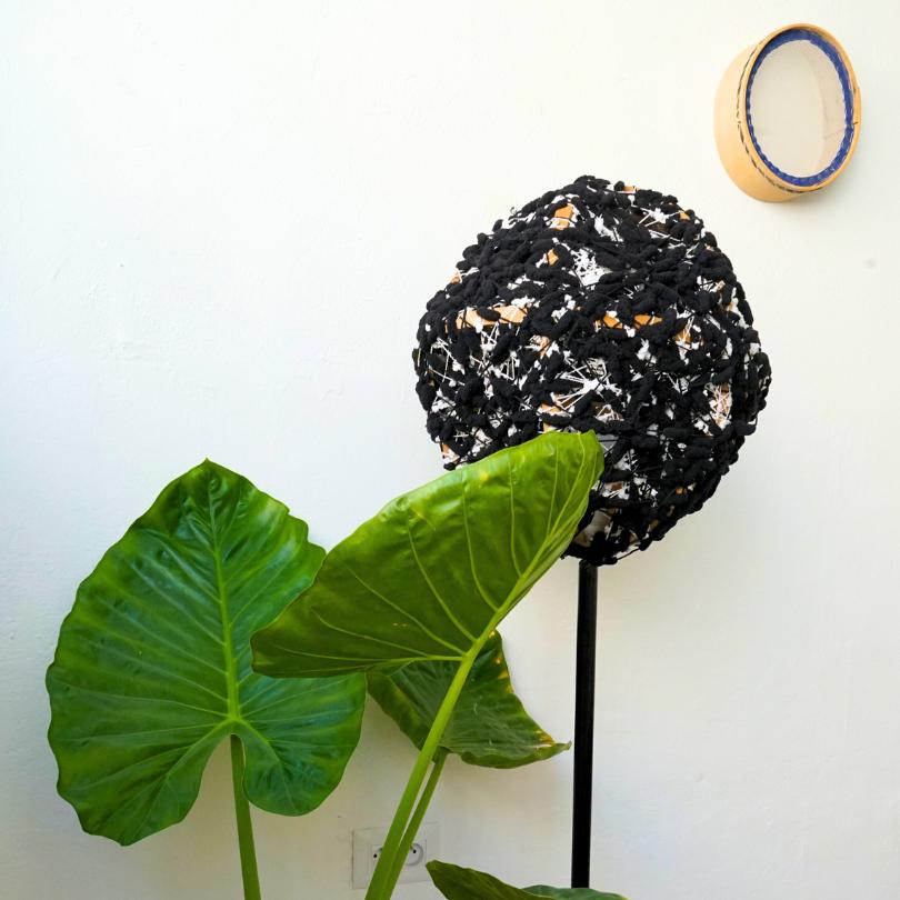 Upcycled lamp with embroidered black wool support