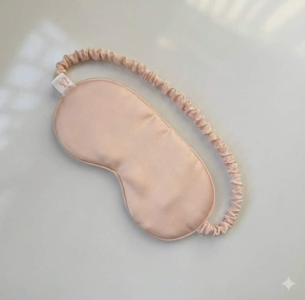 masque de sommeil satin luxe Peche rosé bebe clair pour un repos parfait