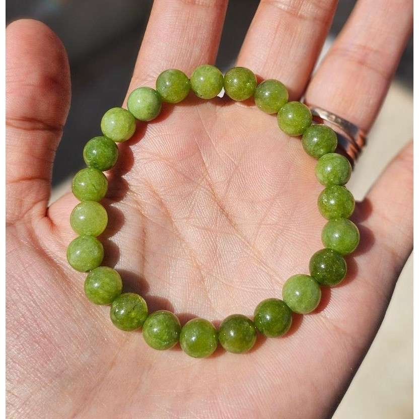 Bracelet péridot élastique en boules de 6 mm pour briller