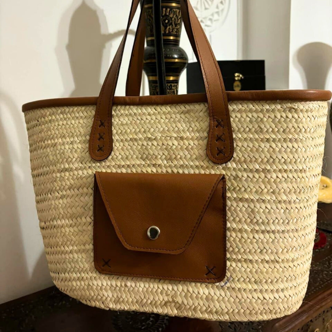 Handcrafted palm tree bassinet with leather flap pocket