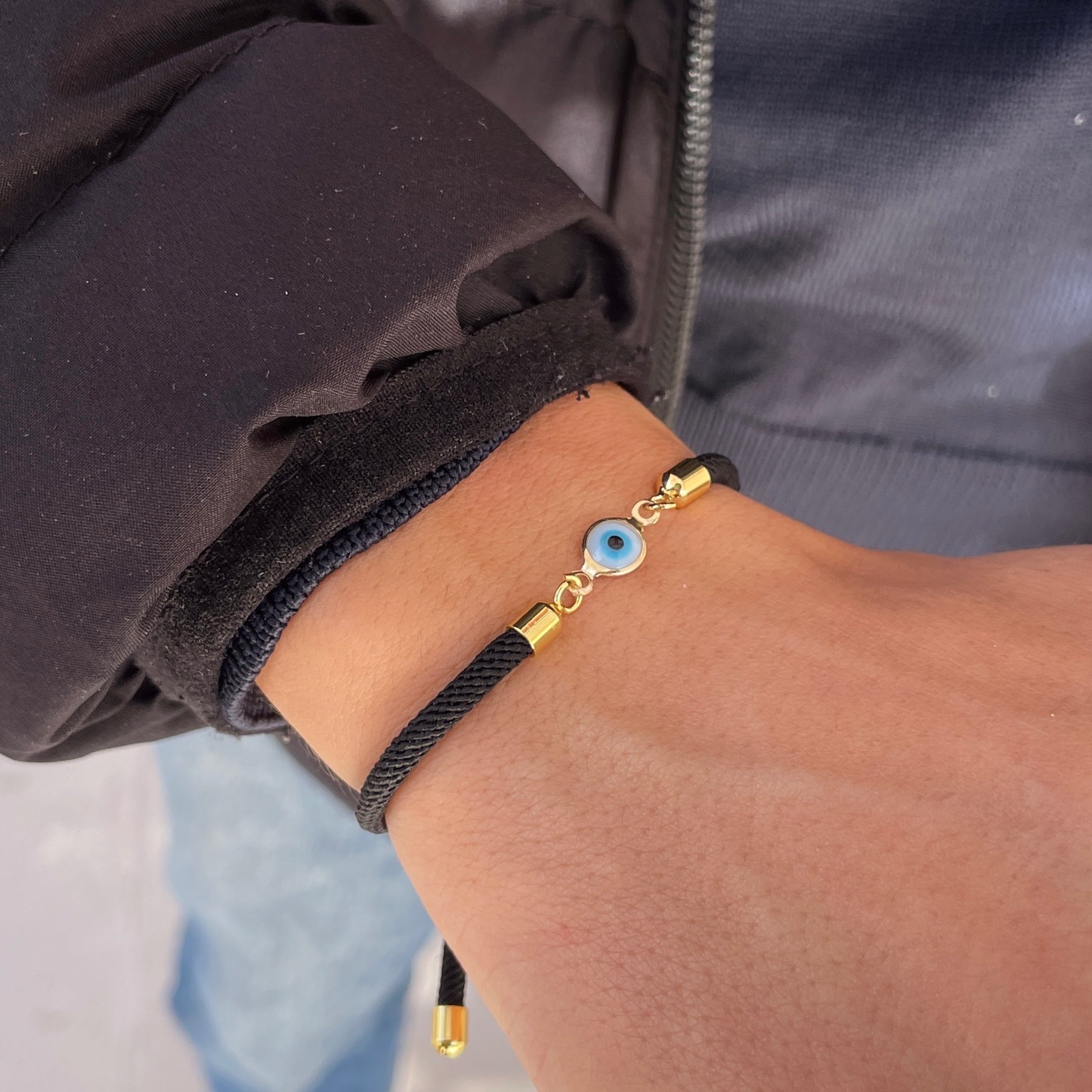 Bracelet petit oeil avec cordon noir ajustable unisexe