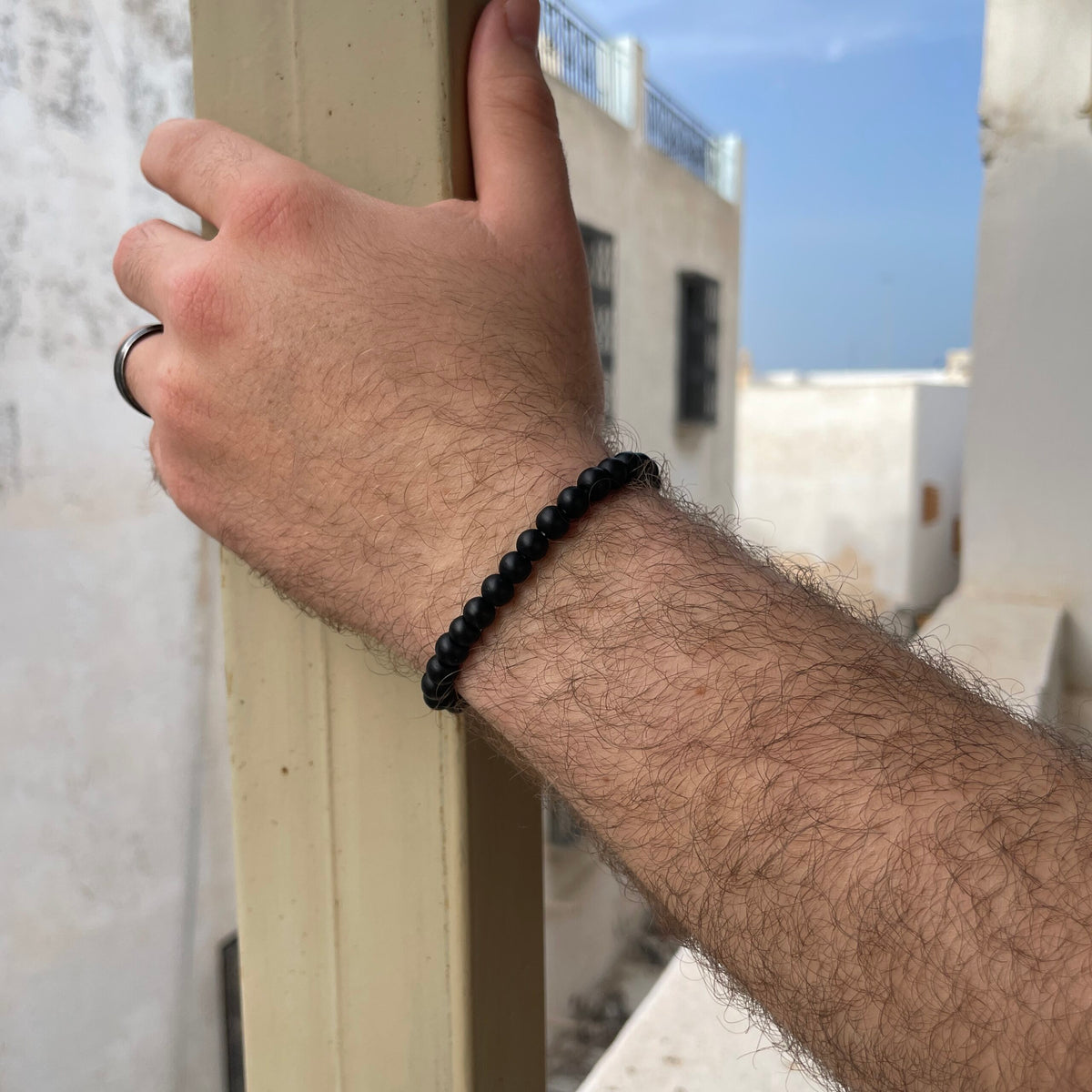Bracelet en perles noir ajustable unisexe