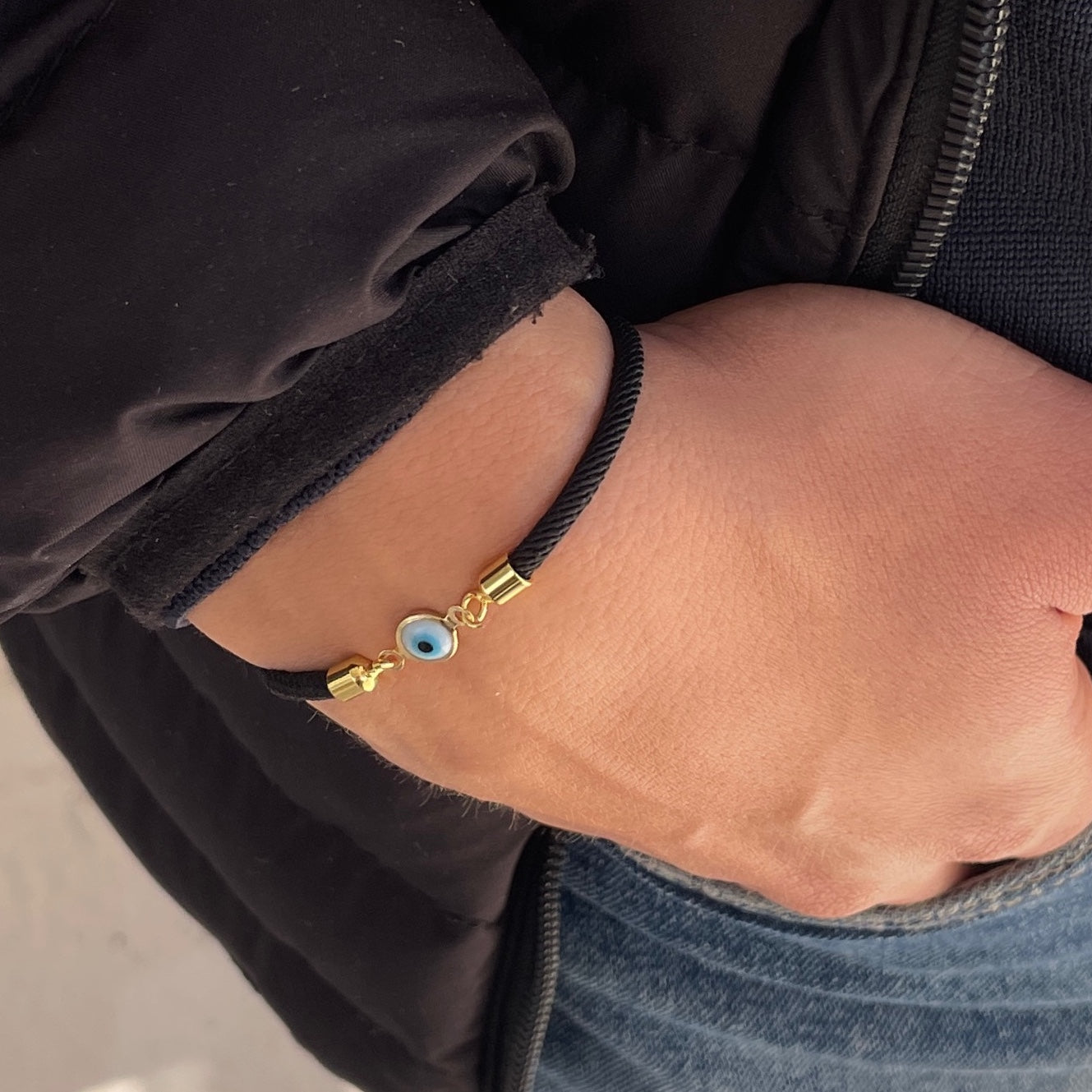 Bracelet petit oeil avec cordon noir ajustable unisexe