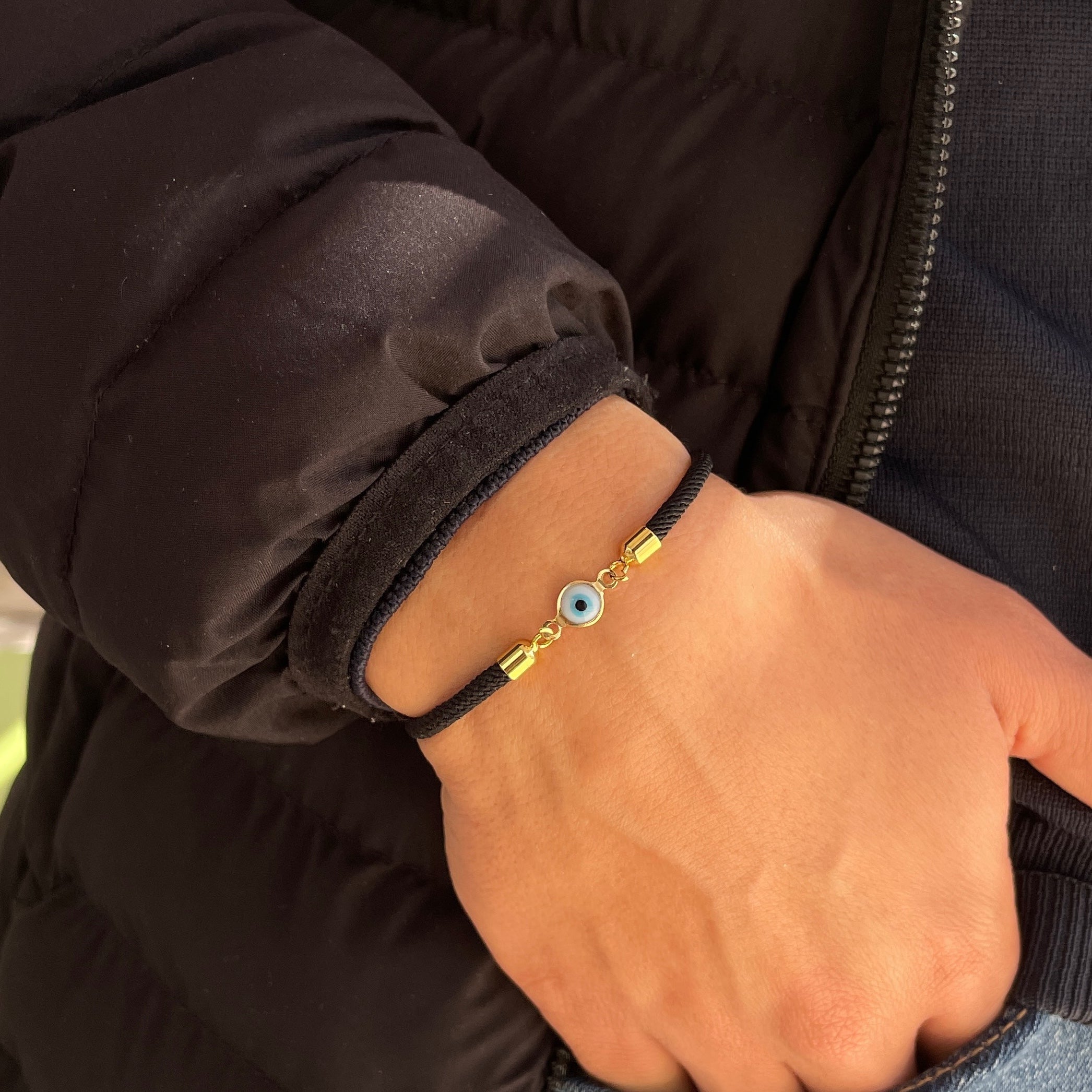 Bracelet petit oeil avec cordon noir ajustable unisexe