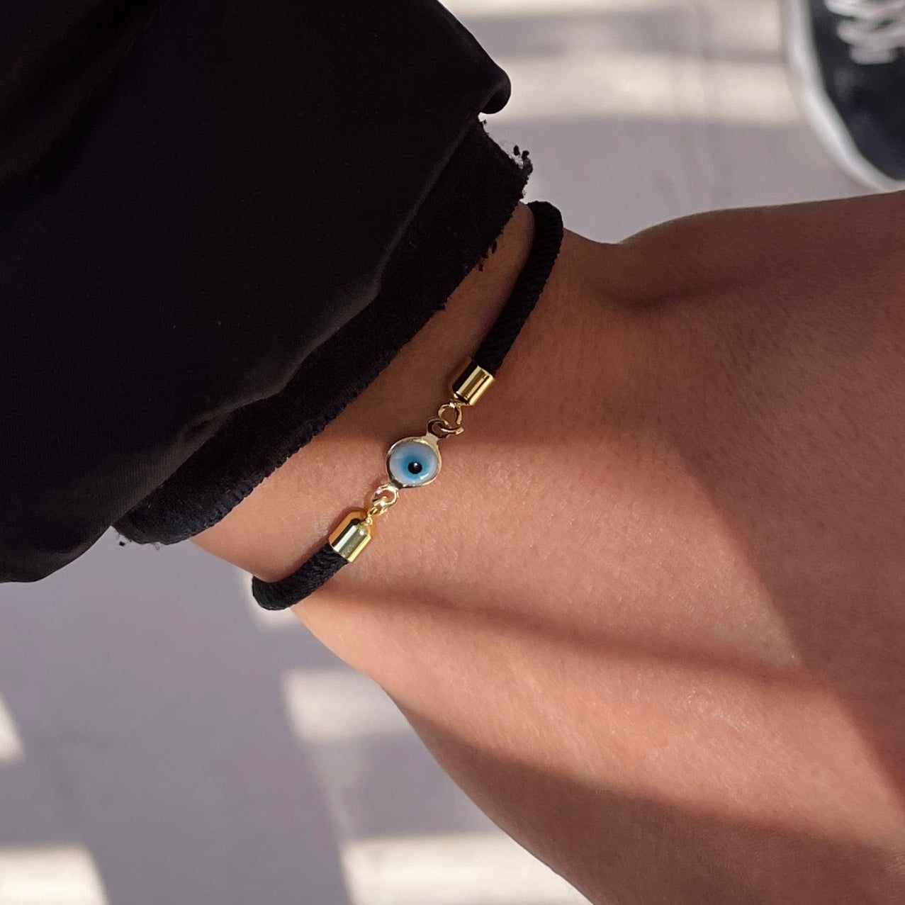 Bracelet petit oeil avec cordon noir ajustable unisexe