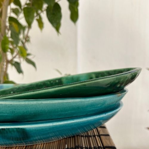 Green oval ceramic dish for dried fruits