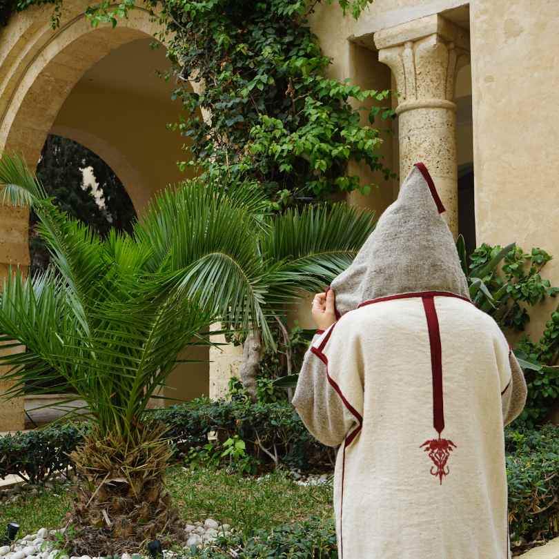 Unisex hand-embroidered Berber coat in natural wool