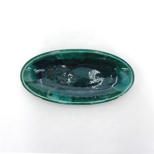 Green oval ceramic dish for dried fruits